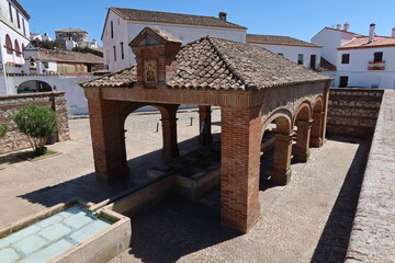Aracena, Huelva, Spain, May 11, 2023: Fuente del concejo, old public laundry in Pozo de la Nieve street. Aracena, Huelva, Spain