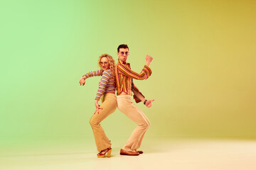 Choreography. Two talented people, autistic man and woman in vintage clothes dancing against...
