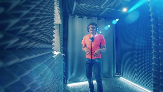 African-american musician singing at a modern sound studio