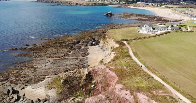 Aerial stationary shot looking over the rocky coastline at Thurlestone Devon England