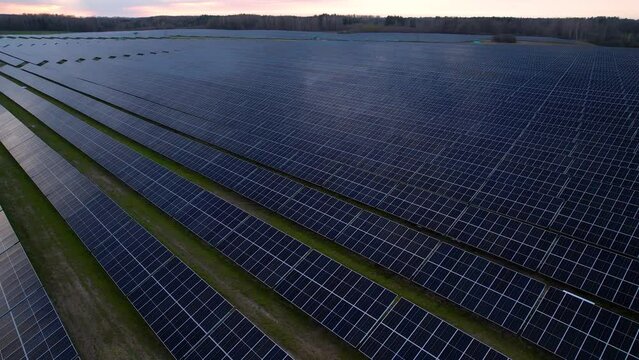 Vast area covered under solar panels for renewable energy production. Aerial pan