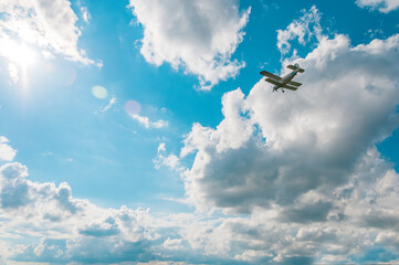 Beautiful blue sky with small vintage plane