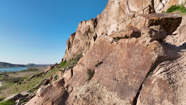 Tamgaly Tas Tract is remarkable for its rock paintings. 5 images of Buddhist deities are carved on the rocks.