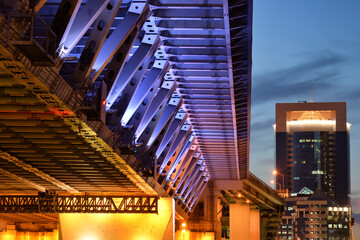 Fototapeta na wymiar Low angle view of illuminated bridge at evening time