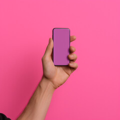 Hands picking up a mobile phone on pink background. Generative AI.