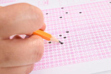 Filling answers of multiple choice examination close up