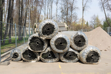 Rolls of building materials in the park