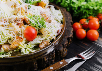Fresh Caesar Salad on a Wooden Kitchen Table