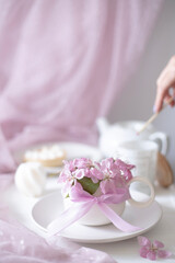 A cup of aromatic coffee and flowers