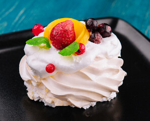 Anna Pavlova cake with cream and fresh berries