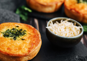 Closeup of mini quiches with dill
