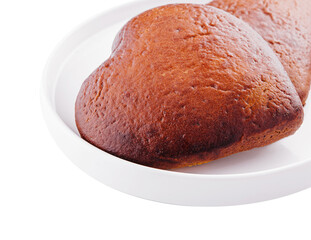 Closeup of two of heart-shaped cookies on plate