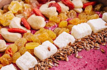Healthy breakfast raisins and cashew nuts smoothie in coconut bowl