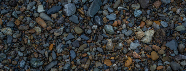 A soothing backdrop of pebble stones, creating a serene and natural ambiance.