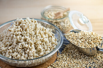 Hot Boiled Job’s Tears millet seed from boiler. White boiled Job’s Tears is highly nutritious cereal healthy fresh organic in salad dish.