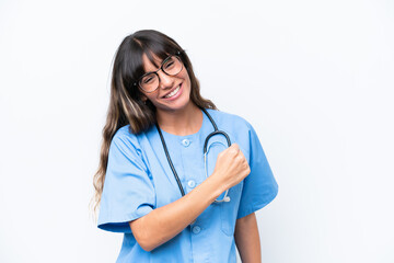 Young caucasian nurse woman isolated on white background celebrating a victory