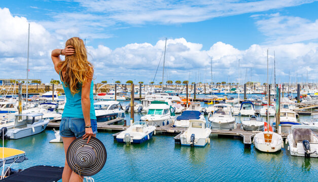 Woman tourist enjoying view on the barbor of Arcachon town- Tourism in France