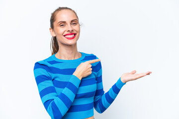Young caucasian woman isolated on white background holding copyspace imaginary on the palm to...