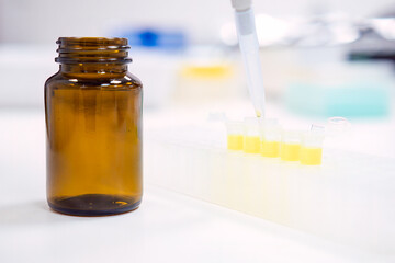 Chemical laboratory. Filling stock reagents with an automatic pipette. 