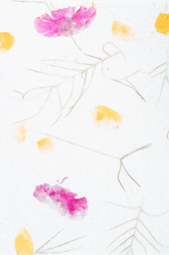 The Mulberry paper sheet decorated with dry flower and leaf texture background