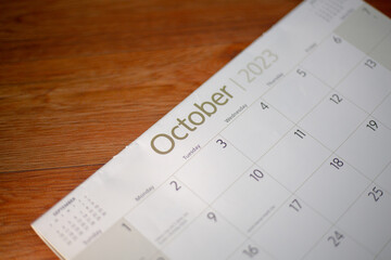 Selective focus shot of a closeup calendar of October 2023. October 2023 calendar isolated on background. 