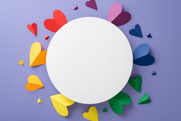 Show your support for the LGBTQ+ community with this top square view flat lay of symbolic composition on a lilac surface, featuring an empty circle surrounded by rainbow colored hearts