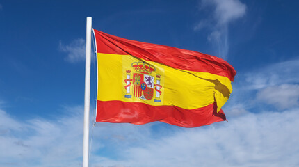 Fototapeta na wymiar Flag of Spain on a blue sky