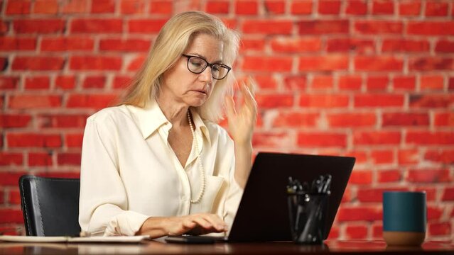 Frustrated upset mature pretty woman cant see computer screen. Put glasses on, adjust, angry at bad eyesight vision, planning budget, review savings and expenses feels tax stress, bills. Copy space