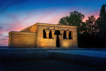 Illuminated Temple of Debod at sunset - ancient Egyptian temple at La Montana Park - Madrid, Spain