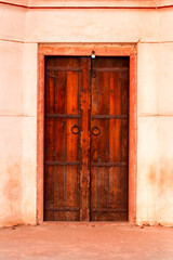 Interior view of Humayun's tomb. beautiful wooden old closed door in mughal architecture, design and art on the walls of Humayun Tomb which is a World Heritage architecture, situated in Delhi, India.