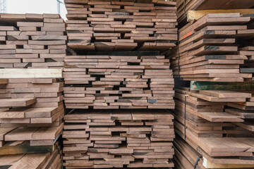 Stacks of lumber being stored in a warehouse