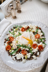 Serving of salad with egg and tomatoes, healthy eating