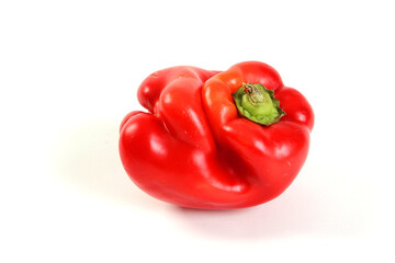 Red bell pepper with lips on white BG