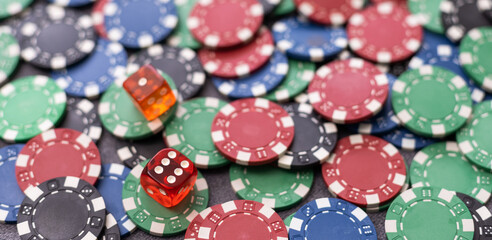 Casino poker chips on the green table.