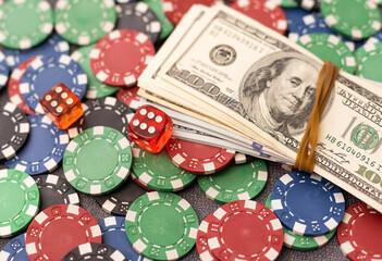 Poker chips and dollar bills on casino table. Gambling. poker as a game of professionals. responsibility for games.