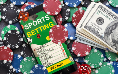 Playing cards, poker chips, and dice, the smartphone. Online casino concept. Gambling. Background.