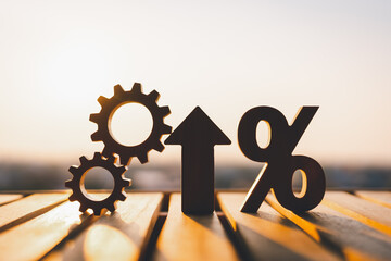 Silhouette of percentage model and up arrow with evening sky Key concepts for success, methods,...