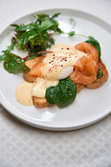Restaurant serving of smoked salmon eggs benedict