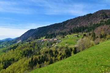 Fototapeta na wymiar Jamnik village bellow Jelovica in Gorenjska, Slovneia in spring