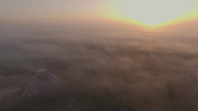 Aerial Drone View Yucatan Chichen Itza Mayan Pyramids Ruins at Sunrise Fog Mexico