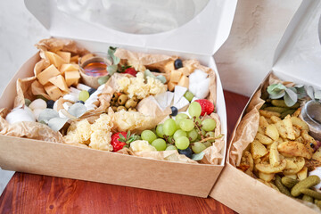 The concept of delivery or picnic. Delicious snack on party or picnic time. Meat and cheese. Italian style banquet. High quality photo