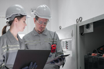 Professional engineer workers training and testing machine at industry factory. Concept people operation in industrial. Industry robot programming software for automated manufacturing technology.