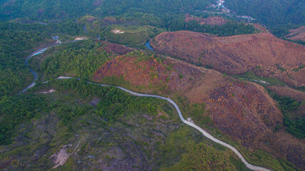 aerial view on the peak in sunset the village far from civilization Traveling on a difficult road..Beautiful sunset view on the hilltop complex..The sun shone through mountain peak after mountain.