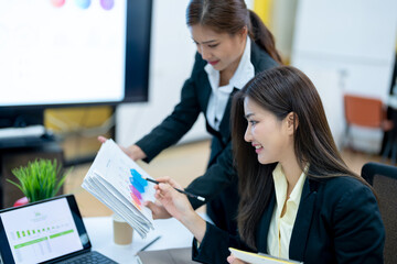 Business women discussing in conference room during meeting at office