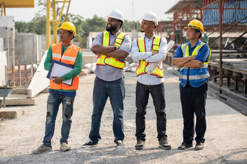 Cross arm African American and Asia team engineer at outdoor precast site work	