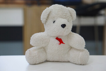 Cute teddy bear doll with blurred background