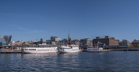Old SS Motala Express steam boat moored at a pier, an sunny early summer day in Stockholm 