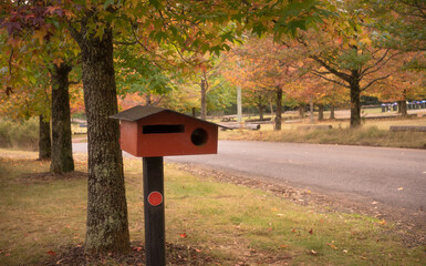mail box in autumn colors, countryside beautiful autumn leaves, abstract background of autumn leaves autumn background, beautiful landscape yellow red and brown in fall months