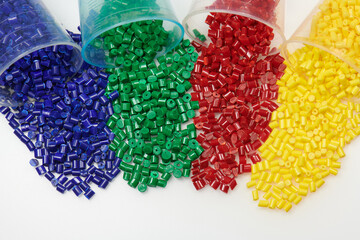 Colored plastic resins in glass test glasses in laboratory