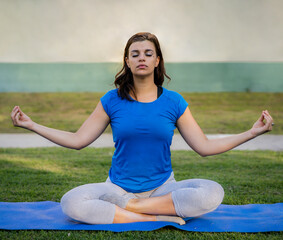 Woman doing yoga exercises in the park